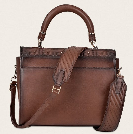 Bolso en piel genuina con cristales.